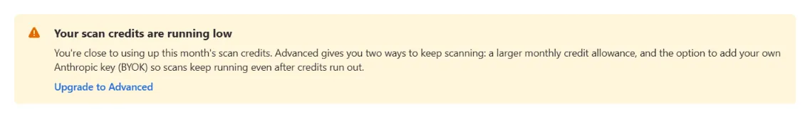 The banner WikiFix shows in-product when credits are running low: "Advanced gives you two ways to keep scanning: a larger monthly credit allowance, and the option to add your own Anthropic key (BYOK) so scans keep running even after credits run out," above an "Upgrade to Advanced" link.